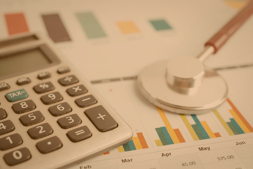 calculator next to stethoscope